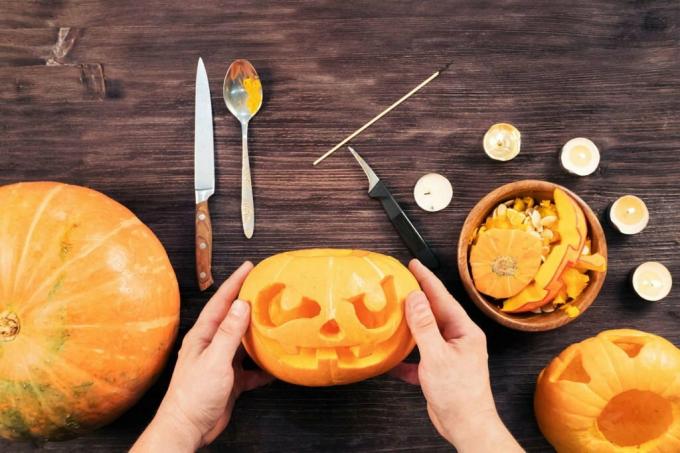 Tools for carving pumpkins lie on a table
