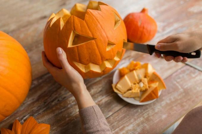Pumpkin is carved with a knife
