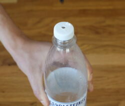 Drill a hole in the lid of the PET bottle